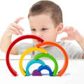 Boy playing with a Montessori Rainbow. 