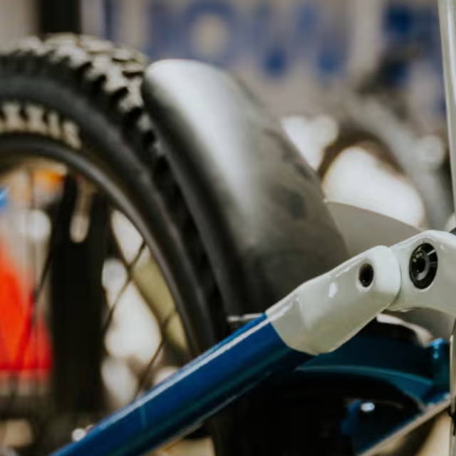 a knobby tire on a full suspension electric mountain bike