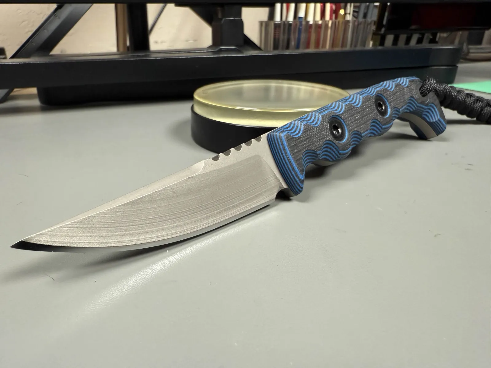 First of five TKell 004 blems.  Four will be gifts later this year, one is for me.  It took a wicked edge at 20 degrees and looks great with the midnight grips.  I’ll either go with a custom made kydex sheath or something in leather.  Haven’t decided yet. – by Adam