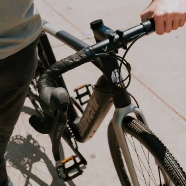 Woman in yellow jacket with electric bike