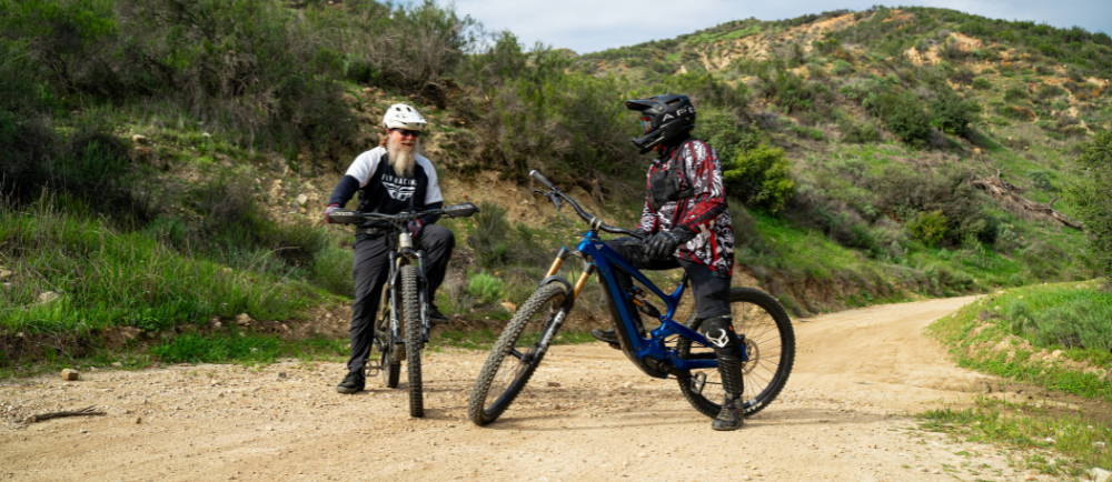 two men riding electric mountain bikes in los angeles