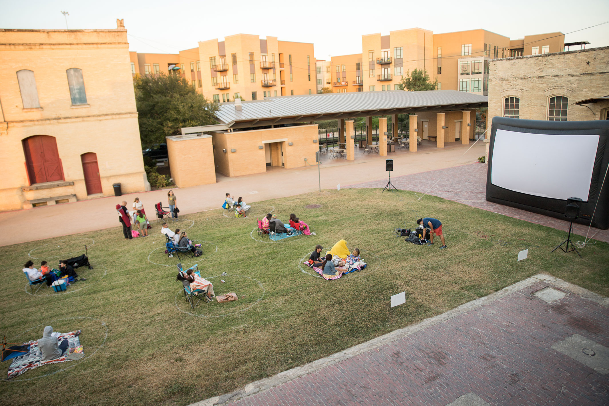 Guests viewing a movie on the west courtyard
