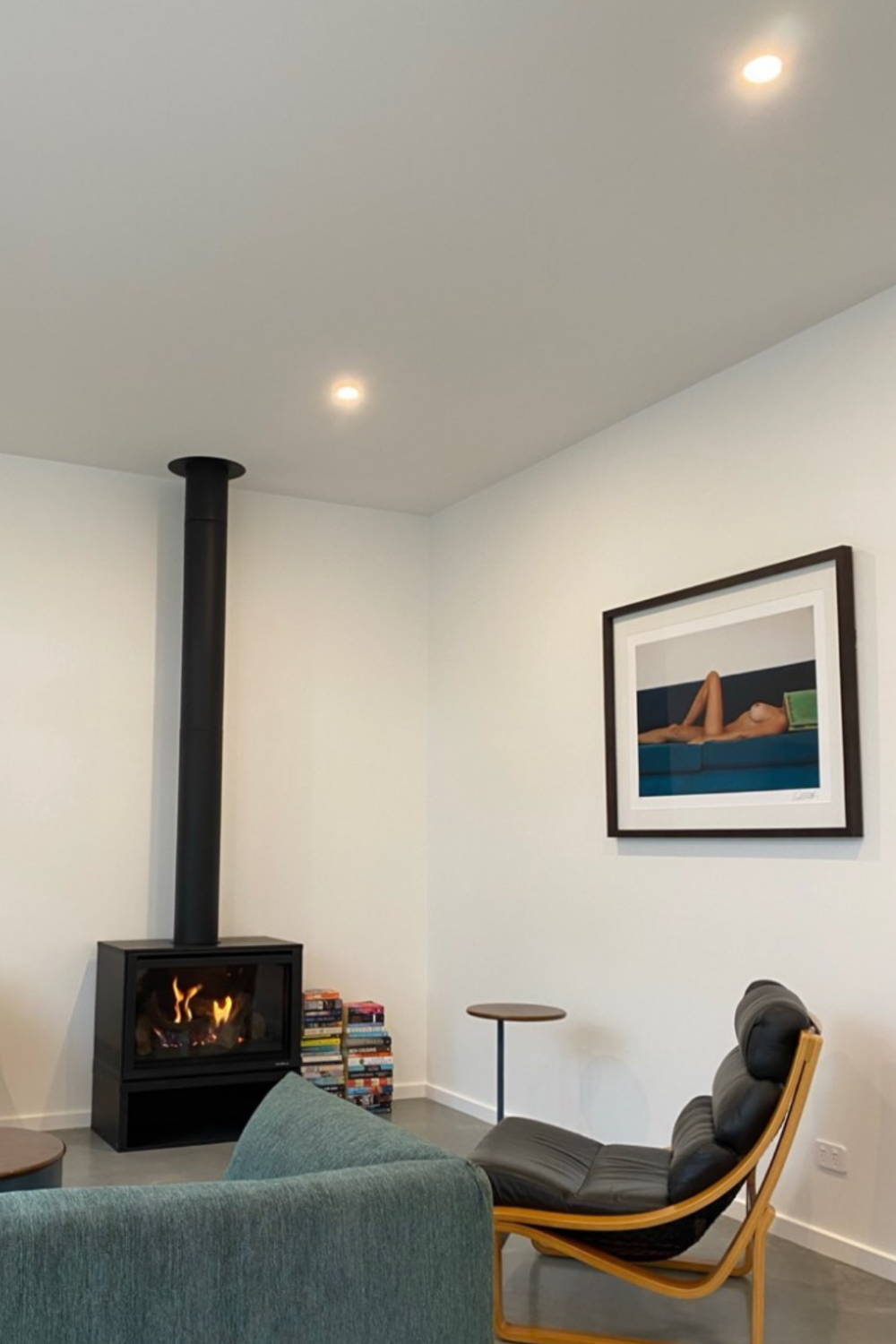 'Lounge Lover' by Dina Broadhurst - A lounge room interior with framed nude photograph on the wall.