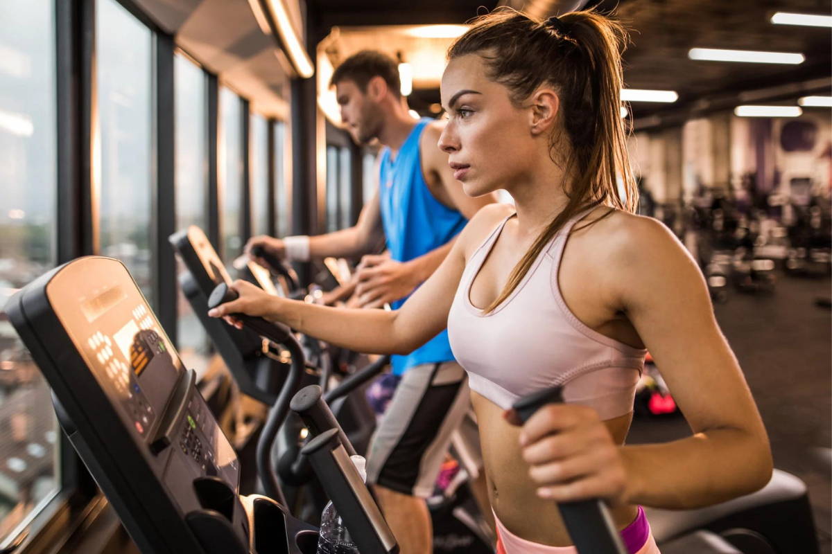 flat-weightlifting-shoes athlete training on front frive elliptical