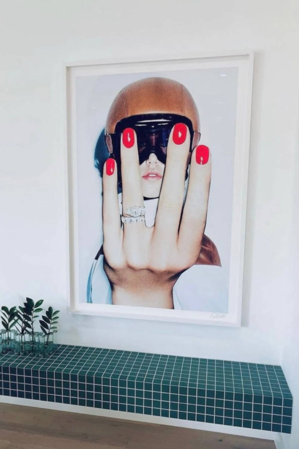 'Easy Rider' by Dina Broadhurst' - A framed art print featuring a girl in a ski helmet with collaged hand with red nails and diamond ring