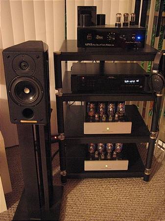 Rack nestled behind speaker.