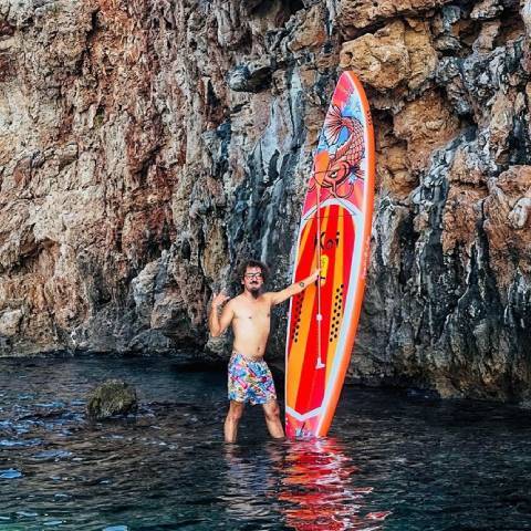 Customer stand up paddleboarding in British Columbia