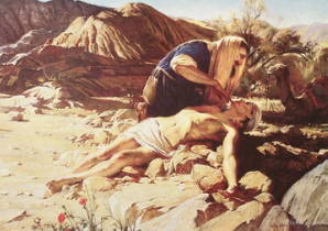 The good Samaritan helping an injured, robbed man in thedesert.