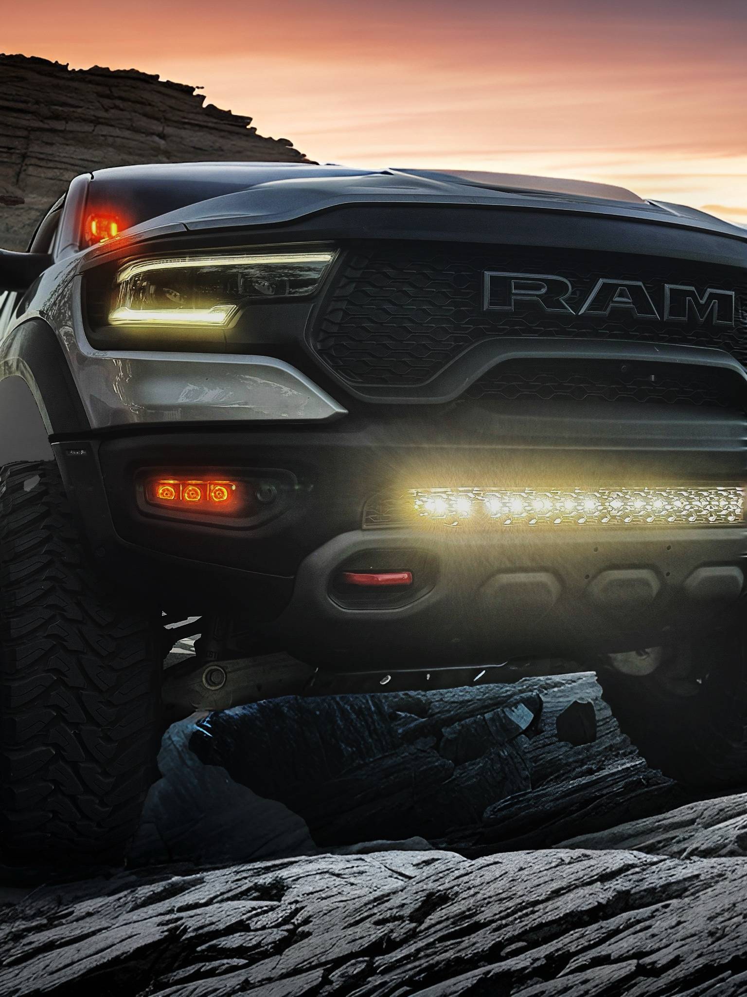 gray ram trx on top of the mountain with white light bar, fog light kit and ditch lights