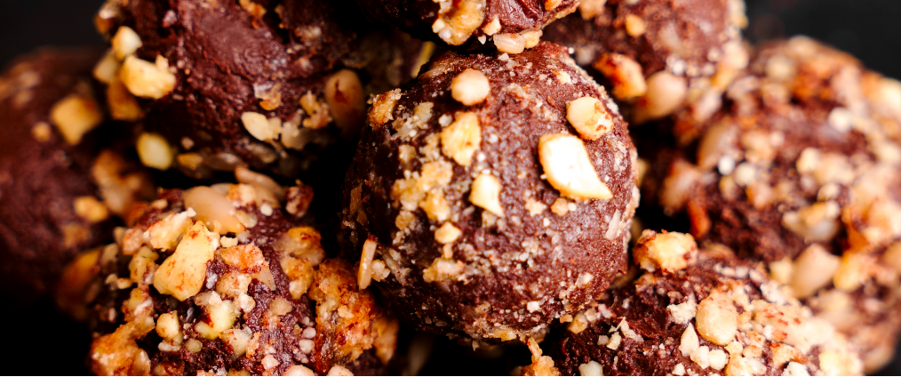 a pile of Chocolate Coconut Truffles covered on Seeds