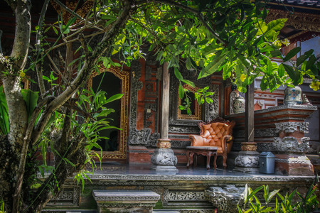 Typical Balinese house with a carved chair on the porch..jpg