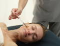 woman receiving a professional lifting facial