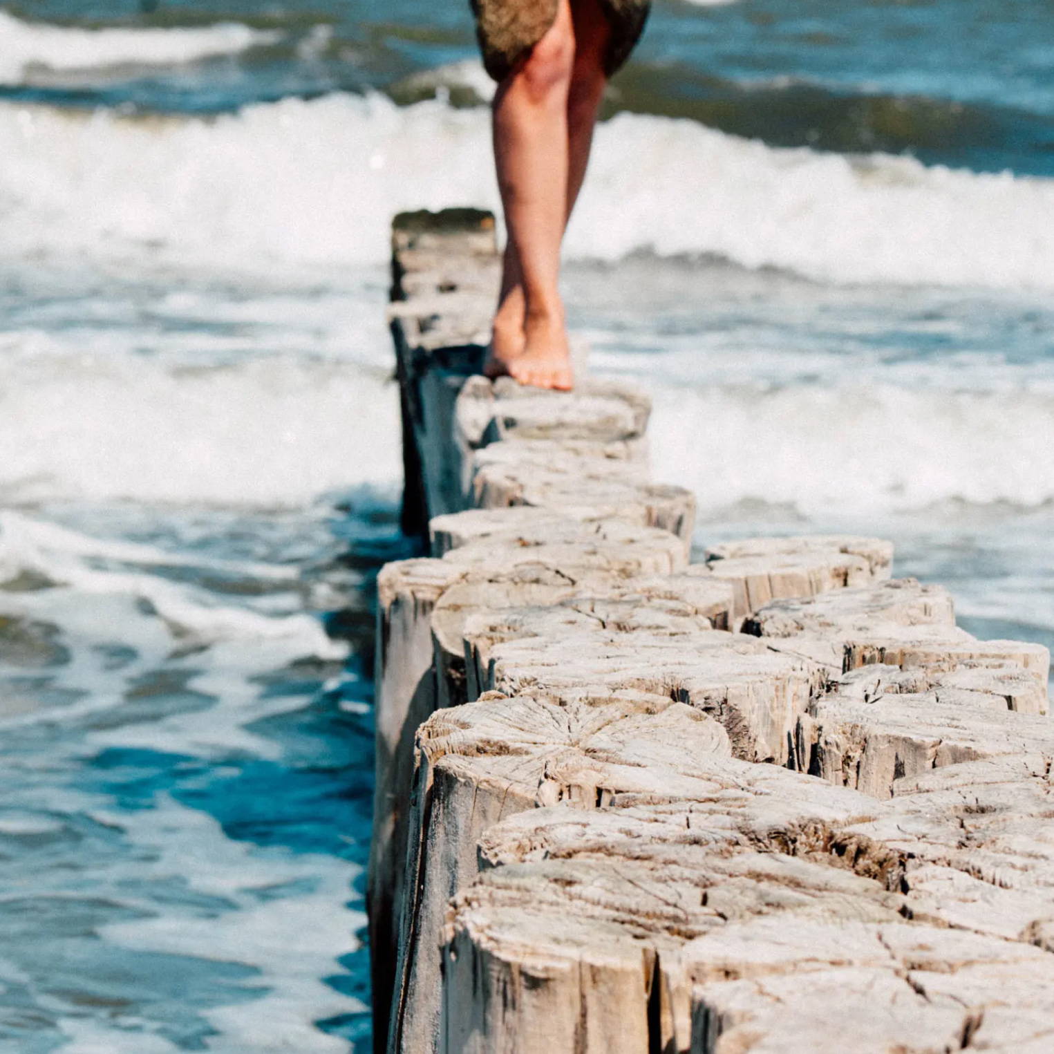 legs walking along longs in the ocean