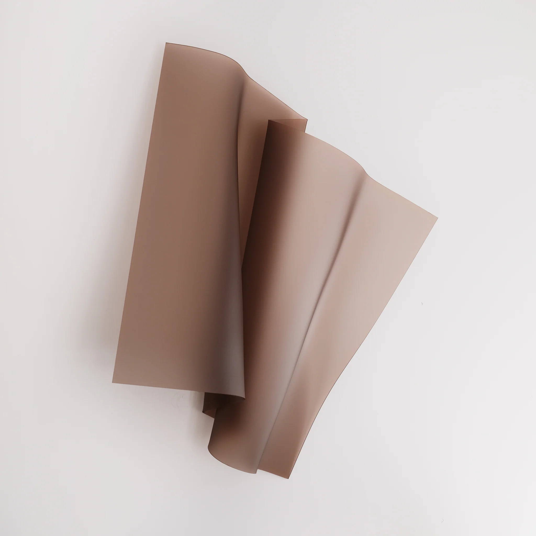 Frosted Mocha by Adele Naidoo – A mocha-coloured wall sculpture with soft, curved folds inspired by floral forms.