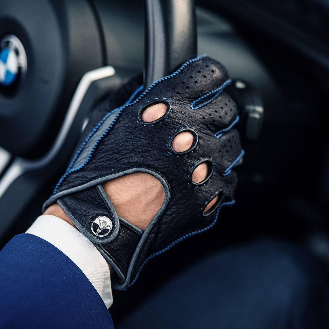Blue leather driving gloves
