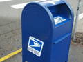 removing graffiti from blue post office box