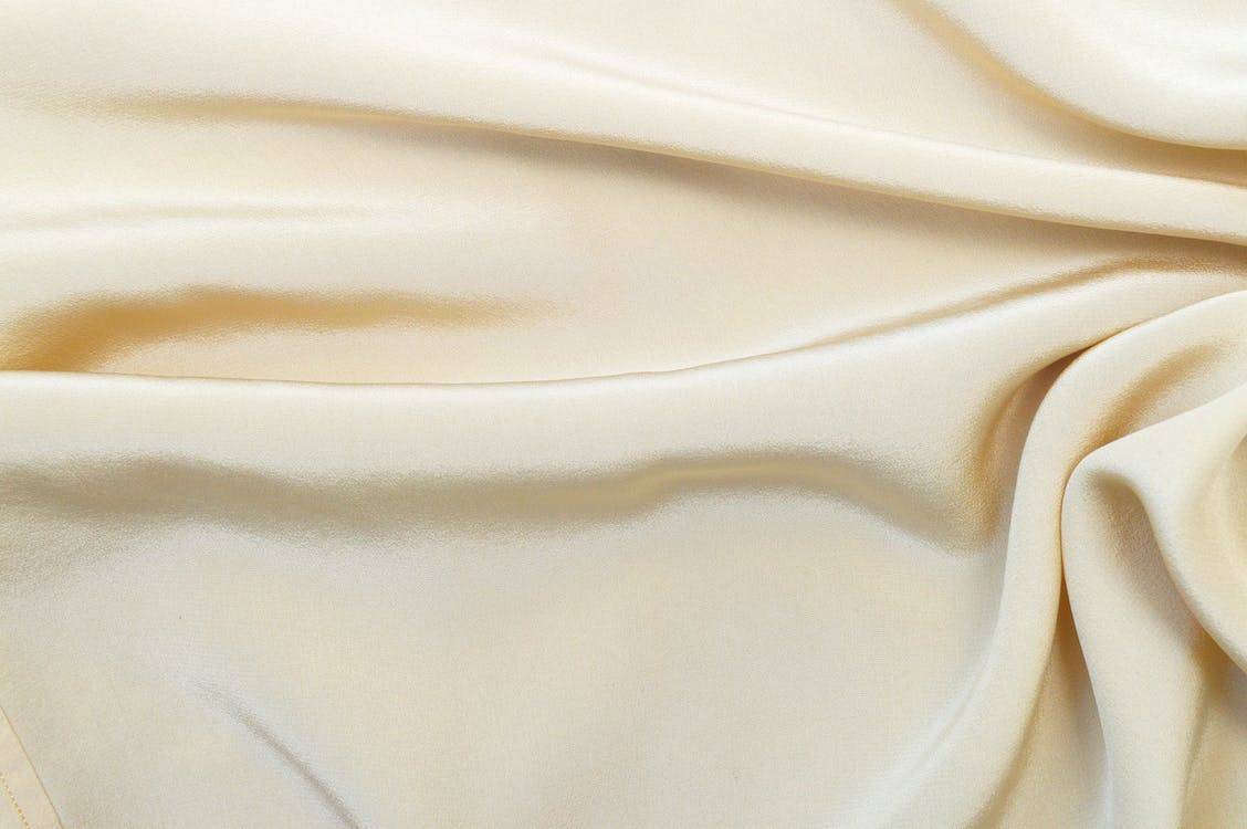 Cream-colored sateen fabric