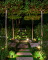 Garden pathways are brought to life through carefully positioned spike lighting, guiding movement while enhancing the atmosphere of the surrounding landscape by Havit Lighting.