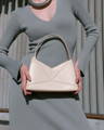 Model holding NOIRANCA handbag Debbie in Maya Blue