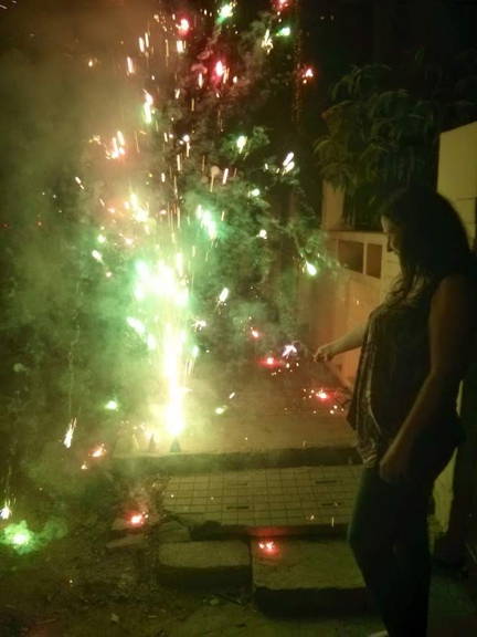 Australian girl lighting fireworks for diwali