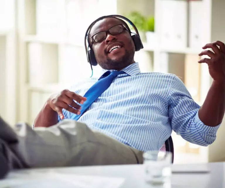Office worker listening to music