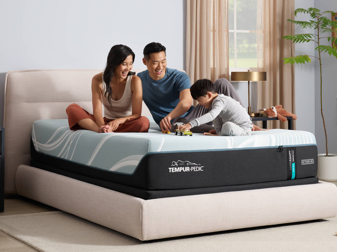 Couple laying on luxe adapt mattress