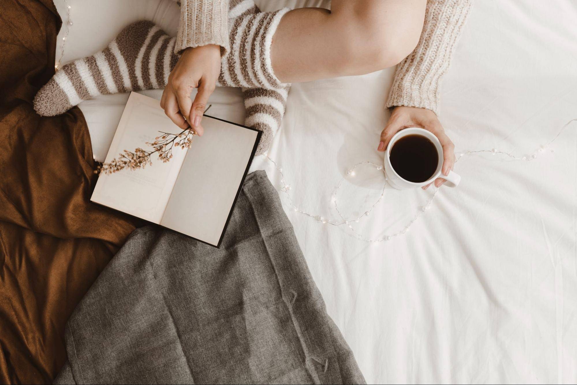 Woman journaling with coffee