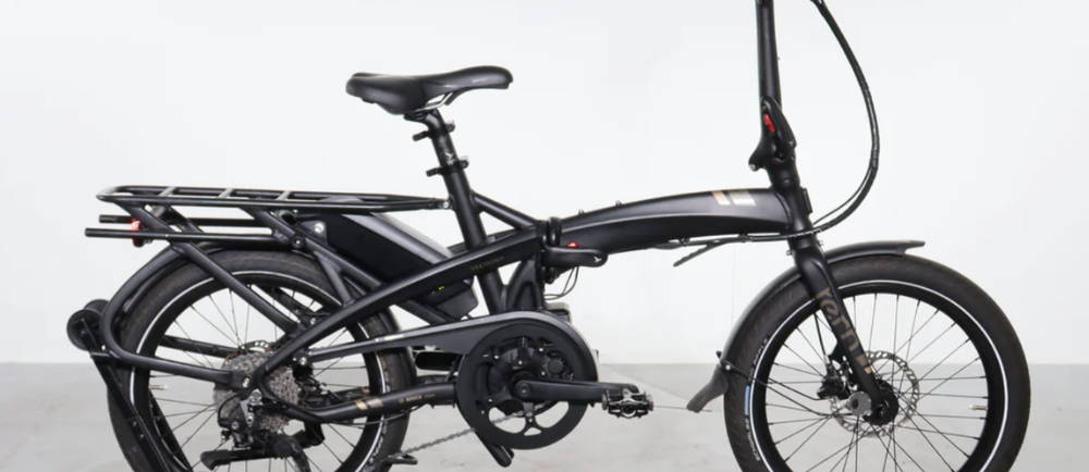 A black Tern Vektron S10 electric folding bike