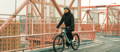 Electric bike rider on New York City bridge
