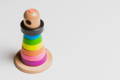 A simple wooden multicolor Montessori stacking rings toy.