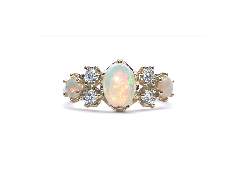 royal ring with 3 opals and 4 diamonds