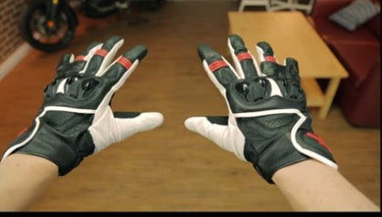 Motorcycle gloves with palm sliders showing the protection system