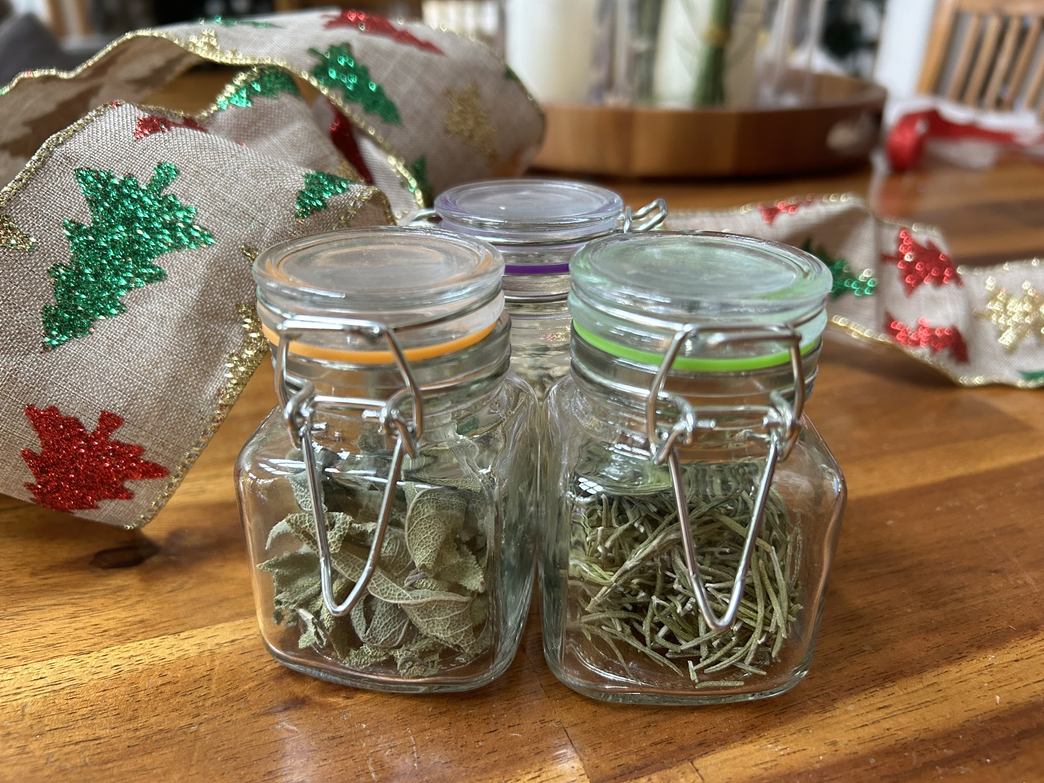 Dried sage and rosemary with some holiday ribbon