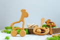 Wooden eco-friendly Montessori rattle toys.