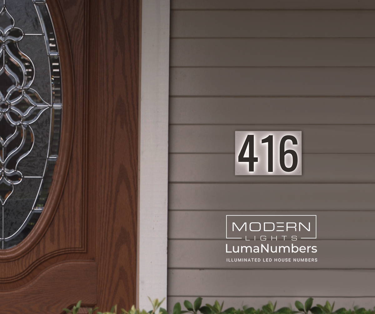 Illuminated address post beside a driveway