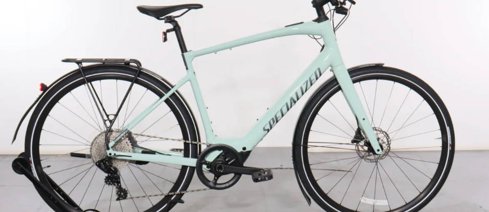 a light blue Specialized Turbo Vado SL 4.0 EQ elctric city bike