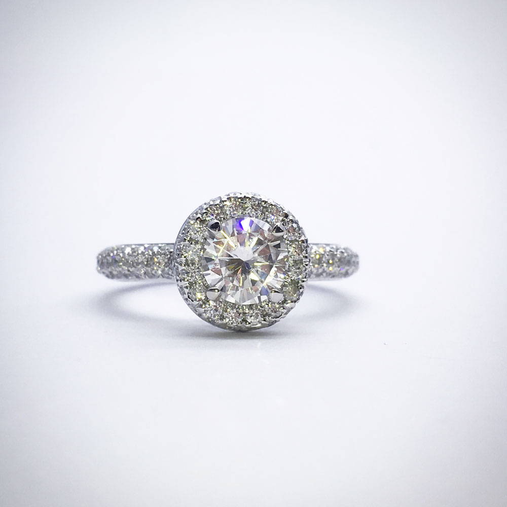 Engagement ring in moissanites with round diamond in halo