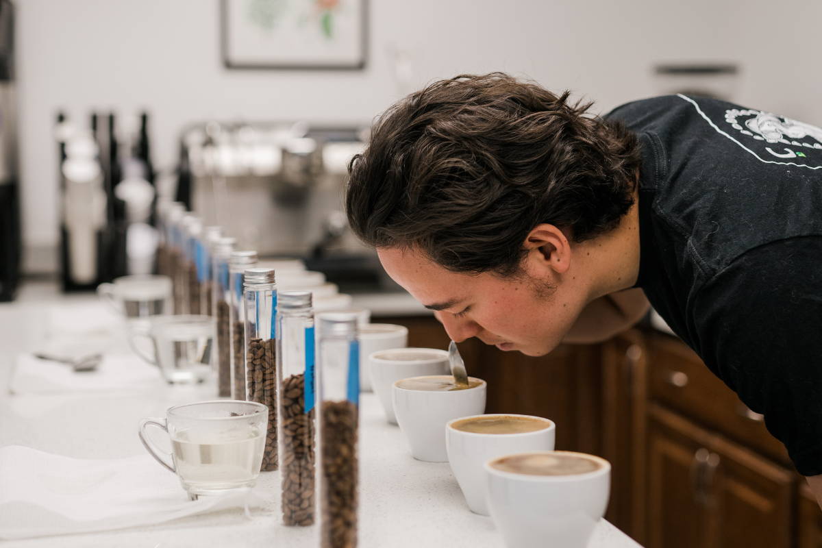 Man smelling coffee