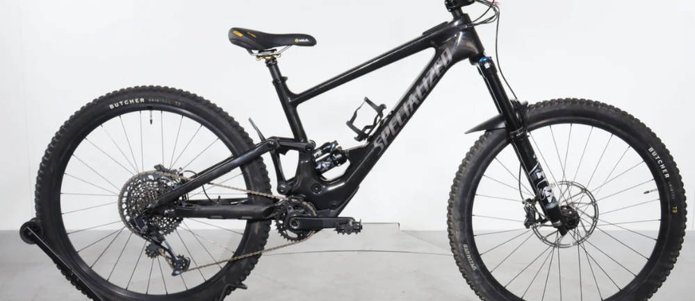 a black Specialized Turbo Kenevo SL Comp full suspension electric mountain bike