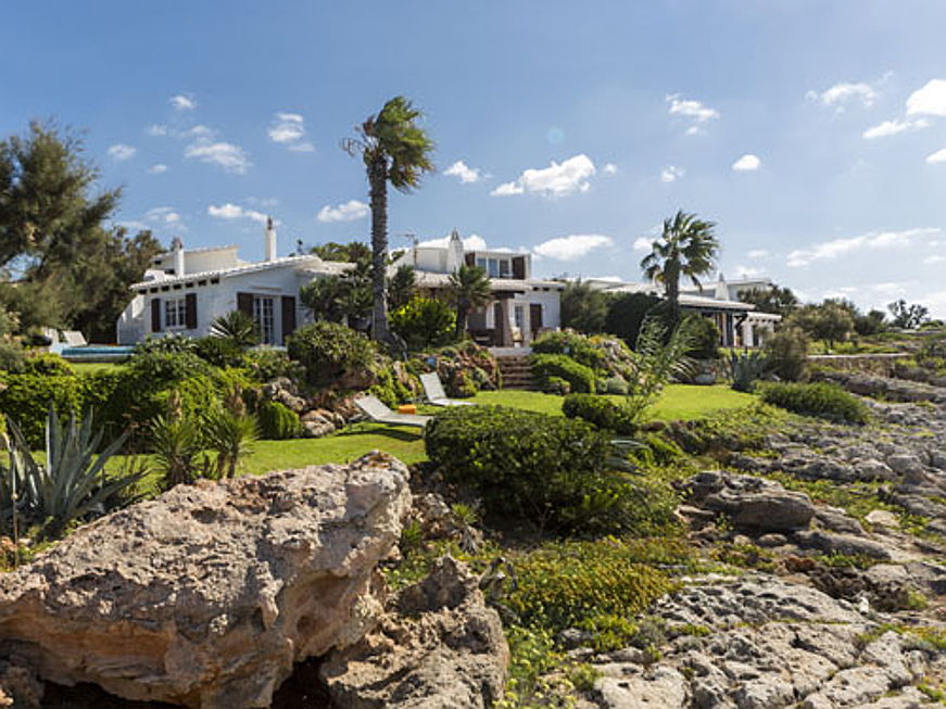  Almancil
- Set in the exclusive region of Cap d’en Font, this homely and welcoming villa has been designed in a Menorcan style. It consists of a spacious salon with sea views, as well as six bedrooms each with en suite bathrooms. The asking price is 2.65 million euros.