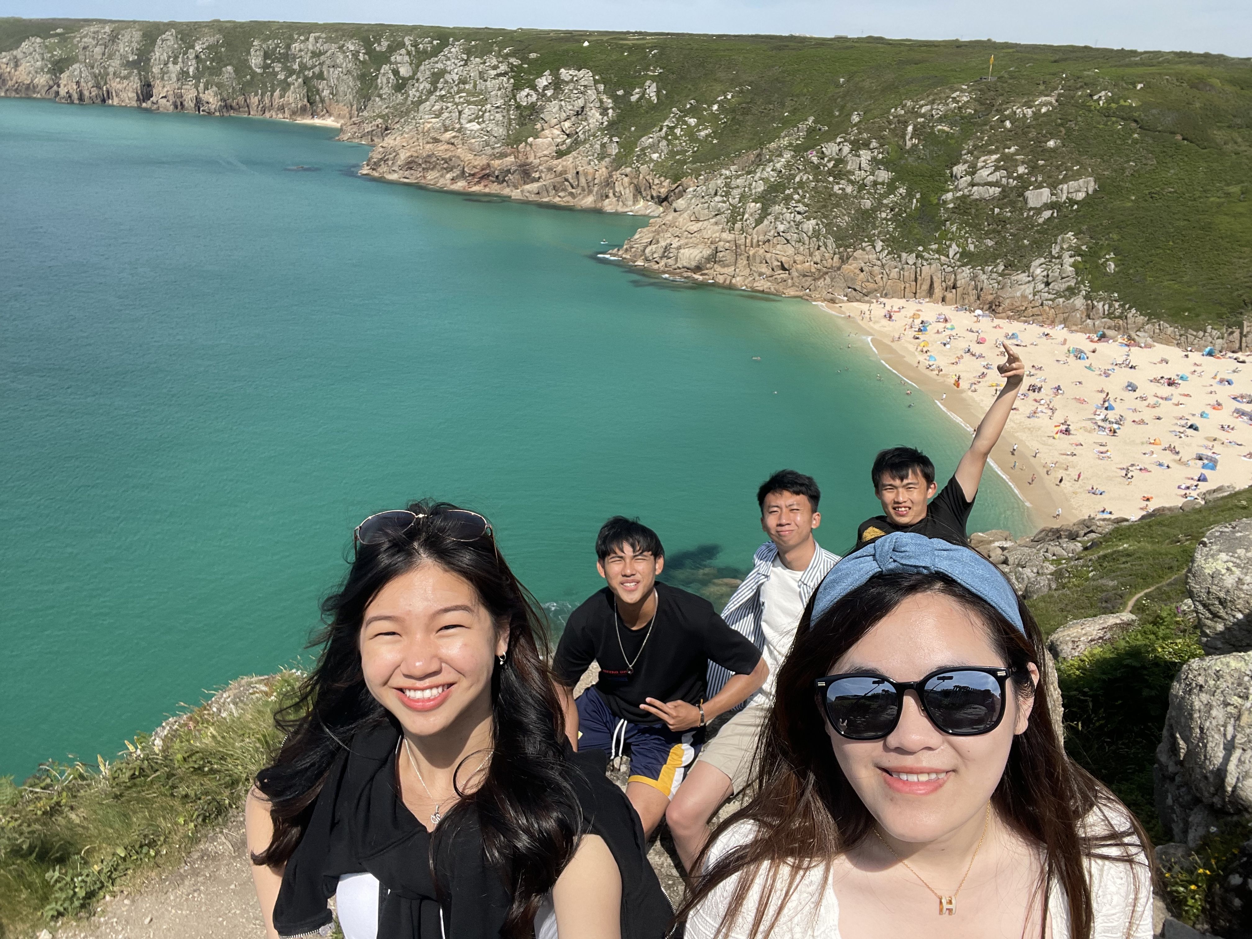 Sure Lyn and some of her friends smiling for the camera on a sunny day while visiting a sandy beach in Cornwall