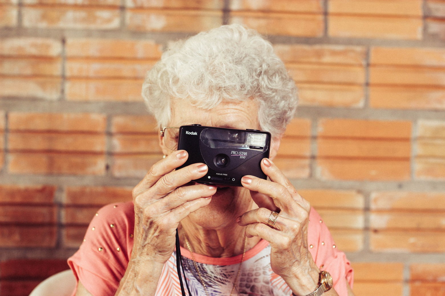 Old woman taking photo