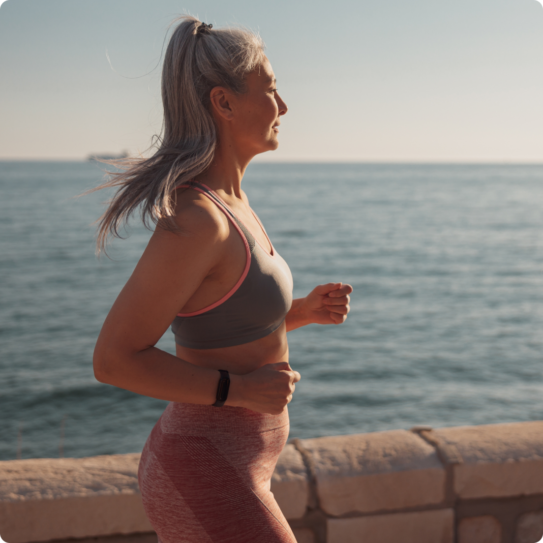 Woman running by the sea