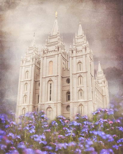 Salt Lake Temple with blue flowers in the foreground.