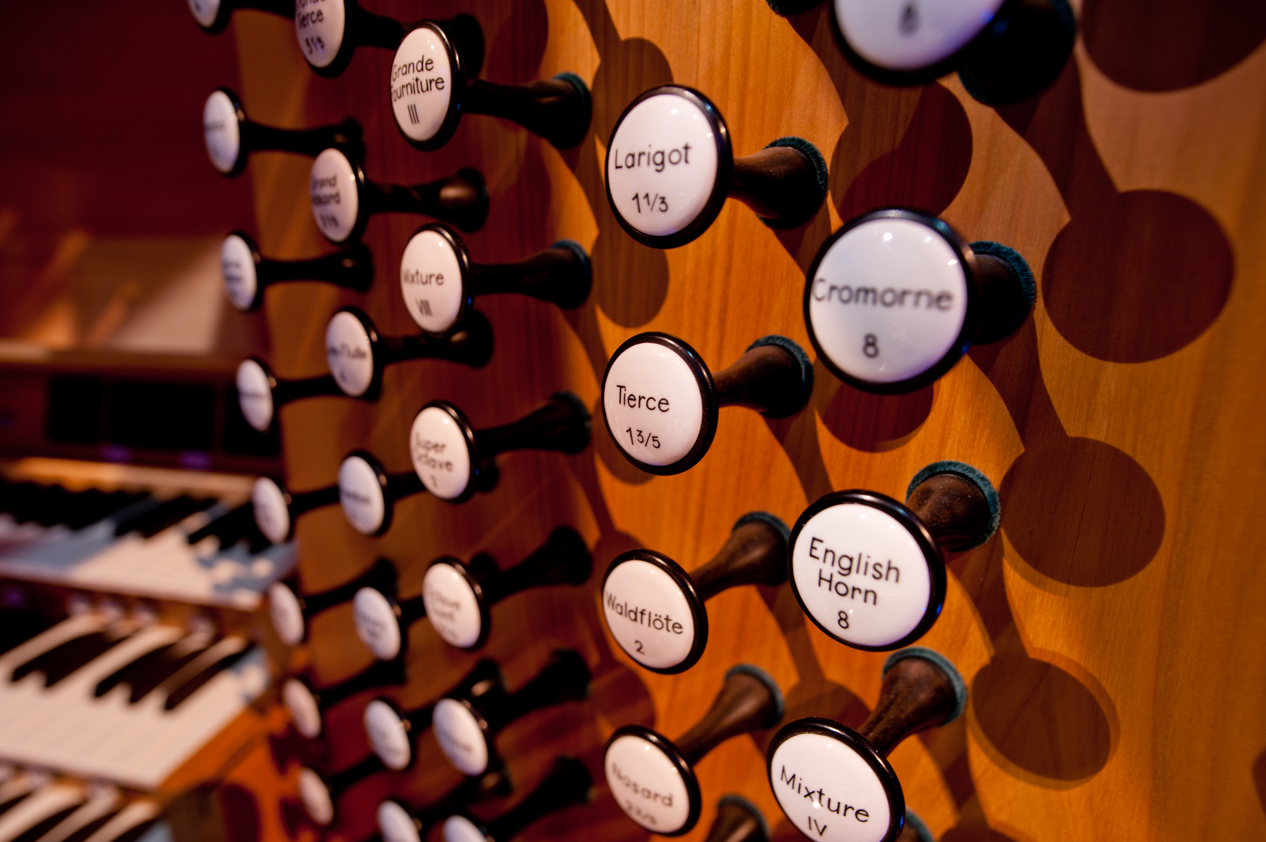 The organ's 128 draw stop controls are hand-lettered on porcelain with solid ebony stems.