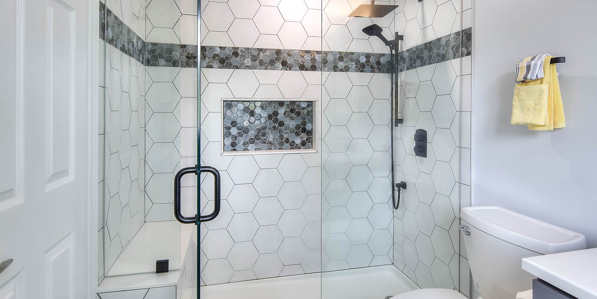 full bathroom with tile flooring, toilet, enclosed shower, and vanity