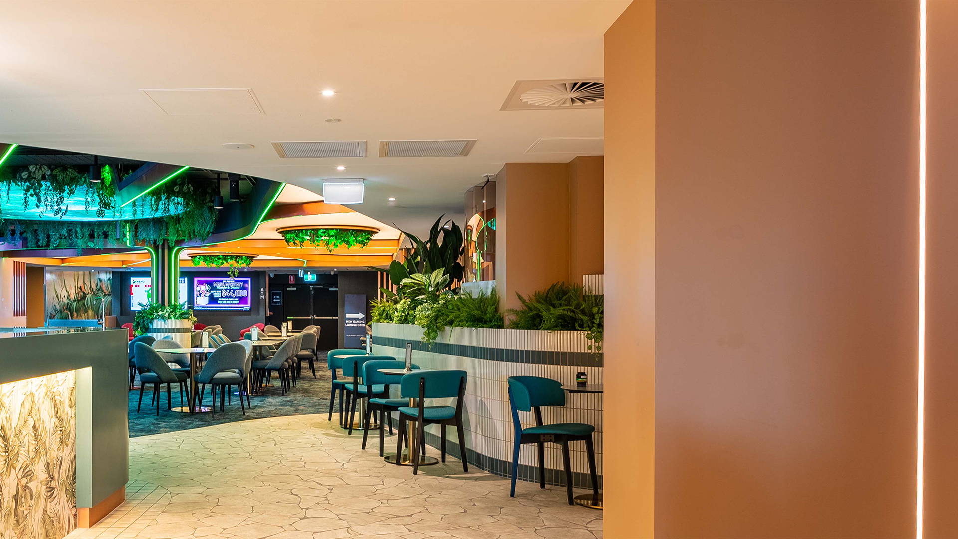 Interior shot of RSL's hallway. Down Lights by Havit Commercial illuminating the bar stools. Commercial Havit Strip Lighting under the bar is also visible 