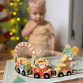 Close up on a snowman figurine featured in the Montessori Christmas Railway set for toddlers.