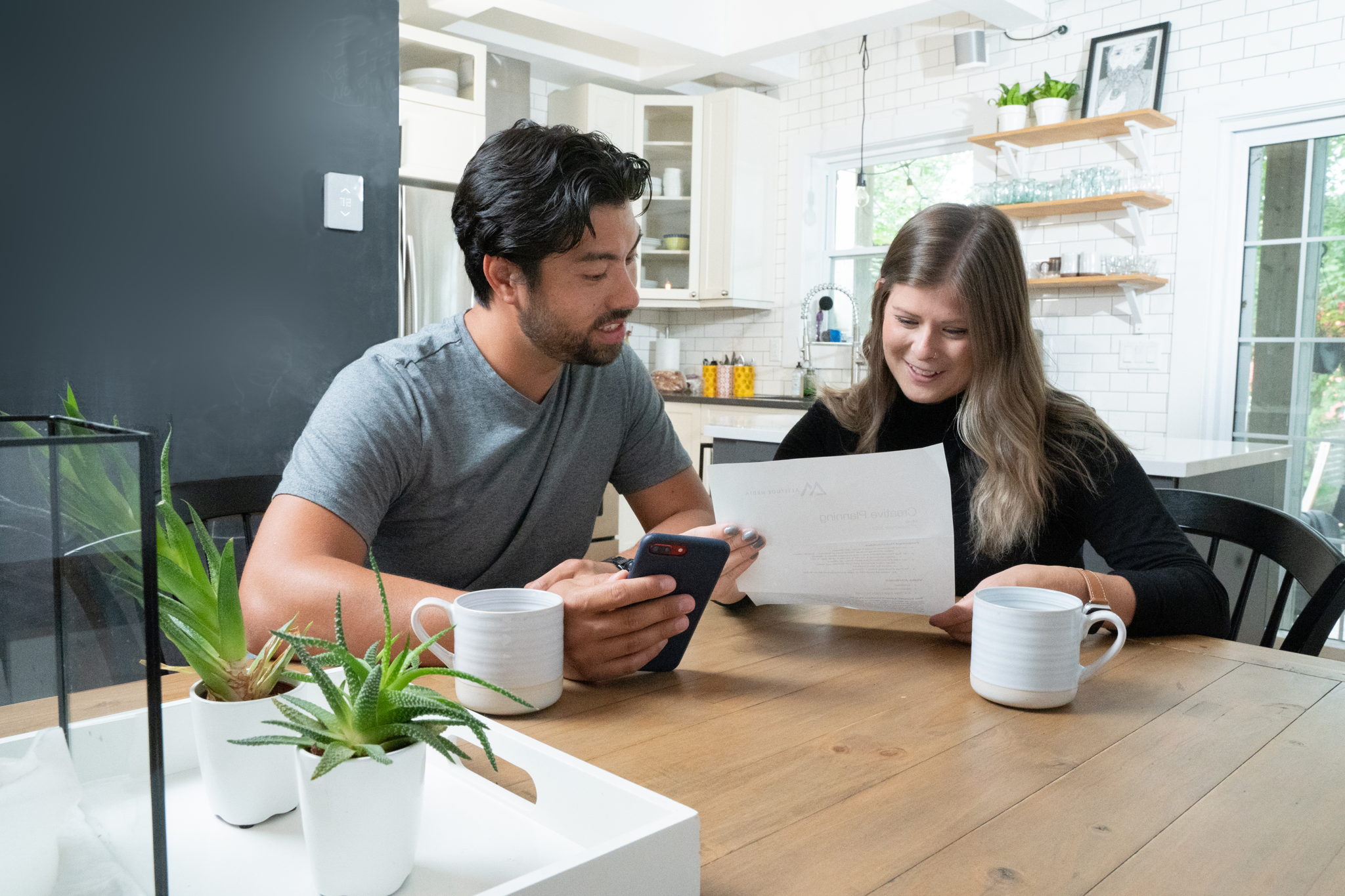 happy couple who saved on their electric bill