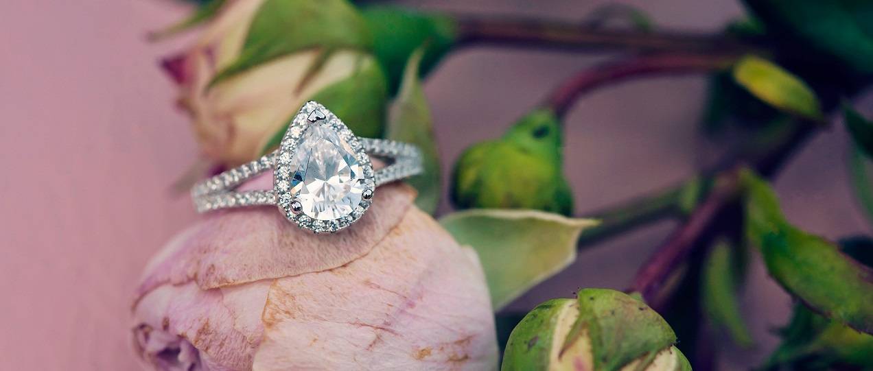 1.5 Carat Pear Cut Diamond Ring With Diamond Halo & Split Shoulders Engagement rings from Pobjoy Diamonds & Fine Jewellery in Surrey -Eternity Rings & Ladies diamond jewellery in Kingswood Surrey